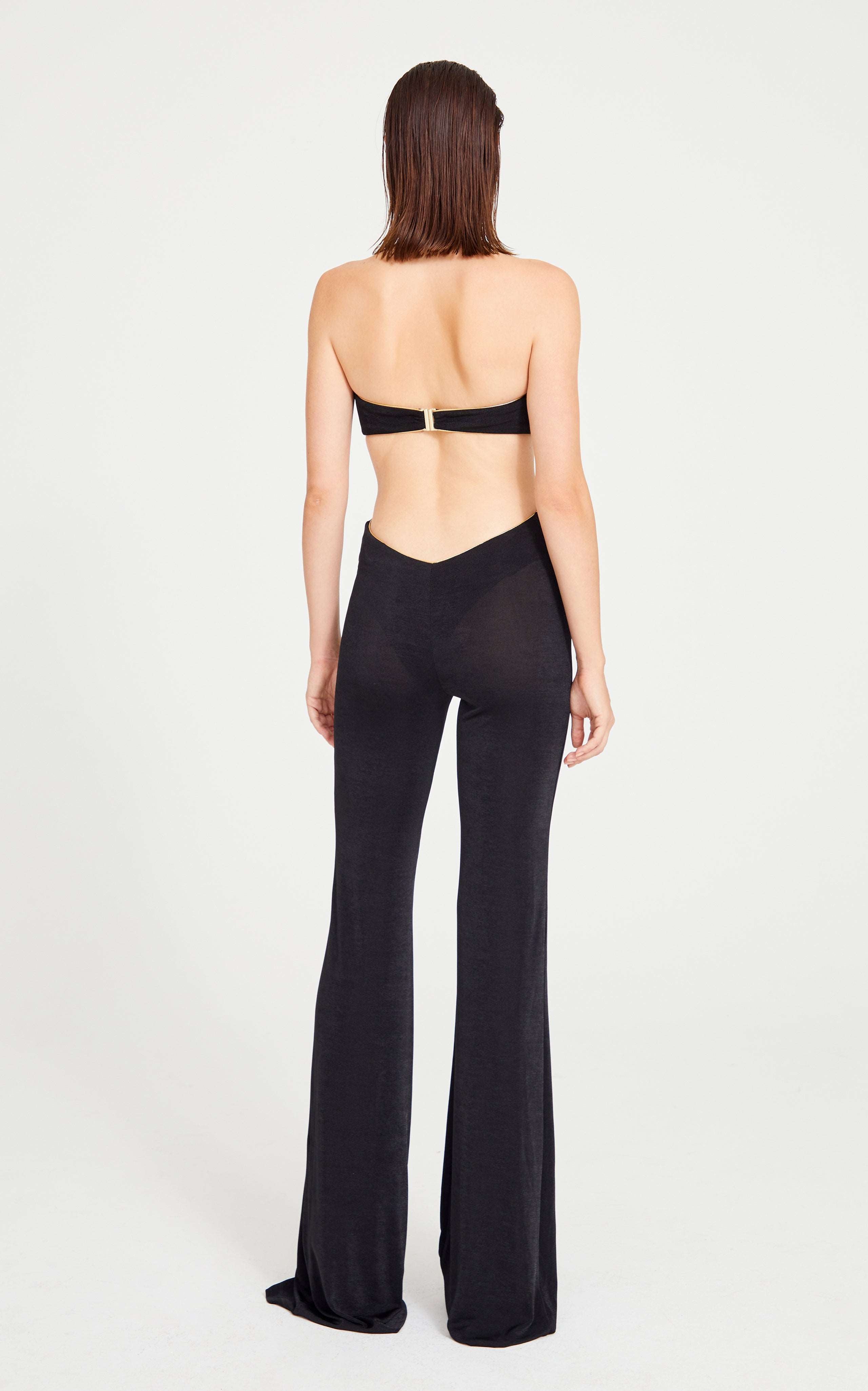 Black Jumpsuit With Gold Lining And Flower Details