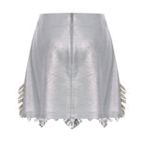 Metallic Knitted Mini Skirt With Patent Feathers