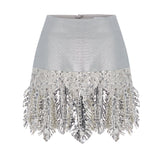 Metallic Knitted Mini Skirt With Patent Feathers