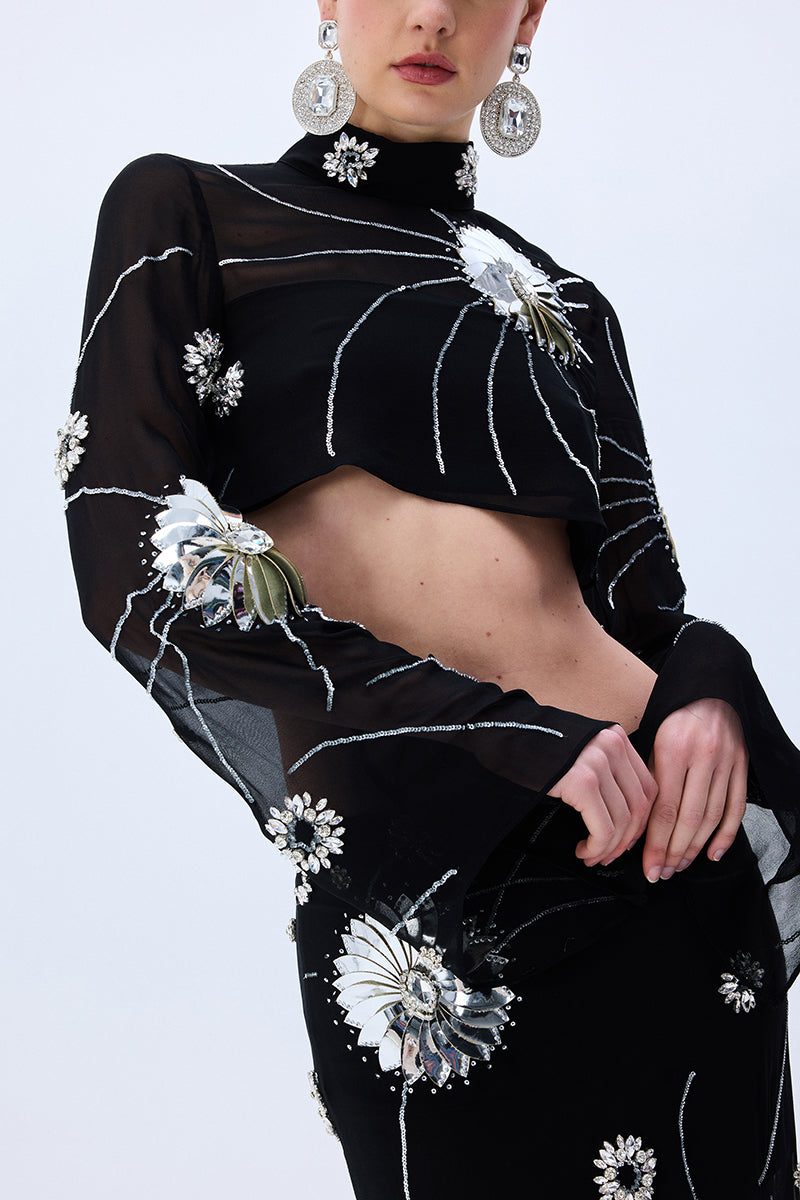 FW25-T-1010-Black-40 raisa_vanessa black-sequined-chiffon-top-with-patent-flowers-and-flare-sleeves