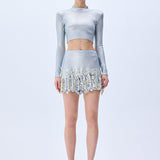 Metallic Knitted Mini Skirt With Patent Feathers
