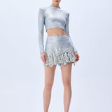 Metallic Knitted Mini Skirt With Patent Feathers