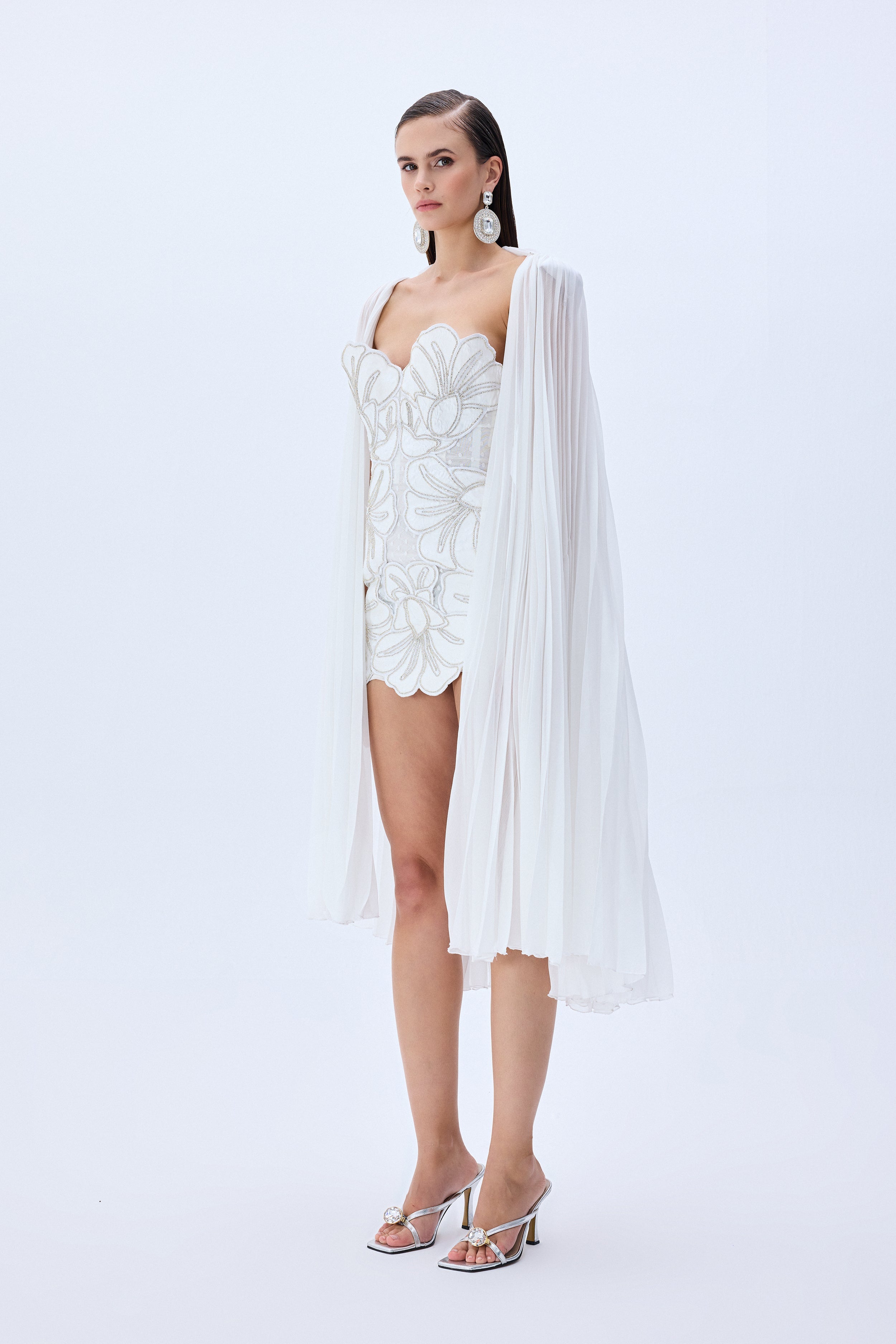 HC25-D-1005-White-36 raisa_vanessa crystal-chain-and-flower-embroidered-lace-mini-dress-with-chiffon-pleated-crystal-chain-with-cape