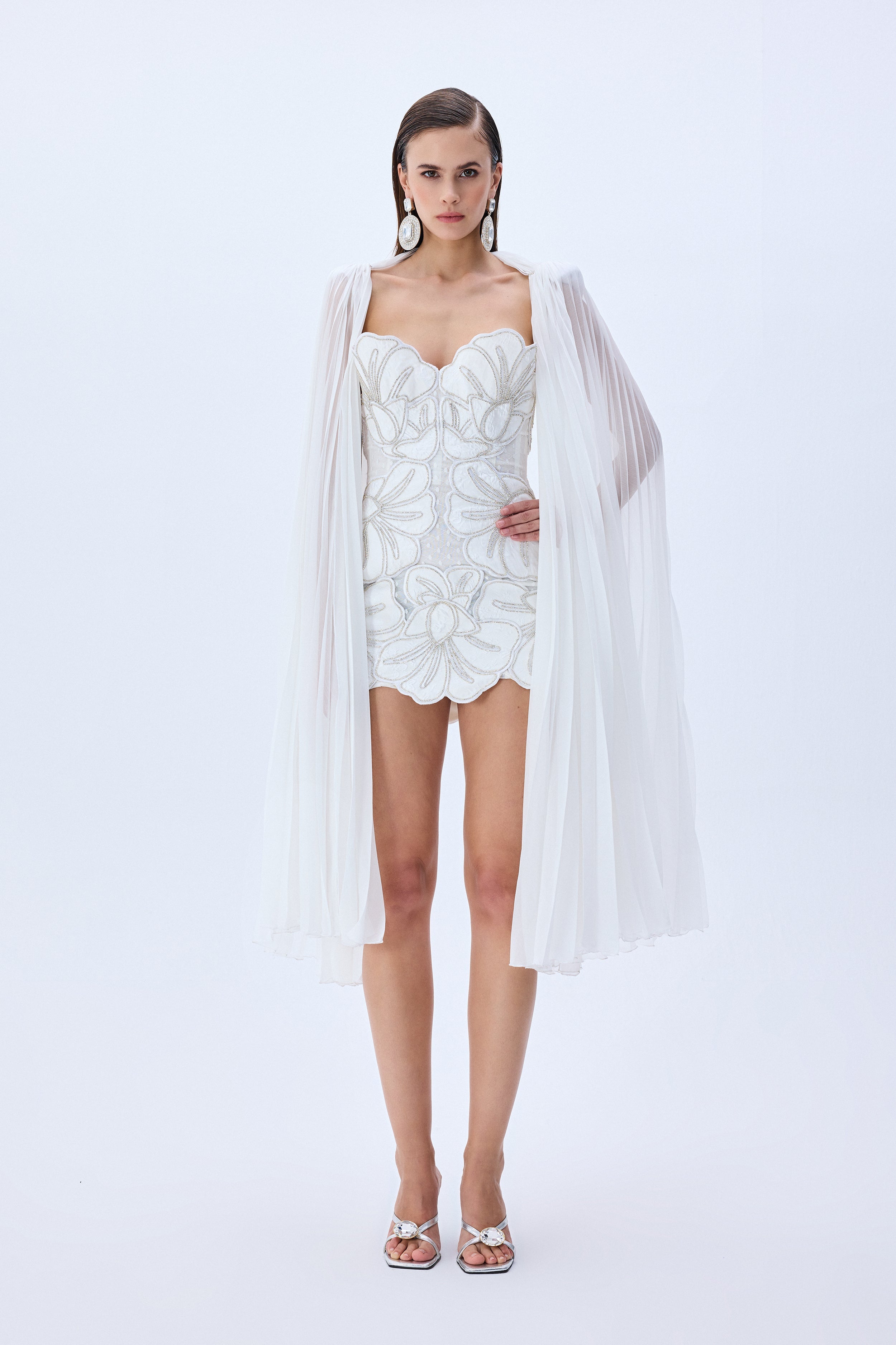 HC25-D-1005-White-38 raisa_vanessa crystal-chain-and-flower-embroidered-lace-mini-dress-with-chiffon-pleated-crystal-chain-with-cape