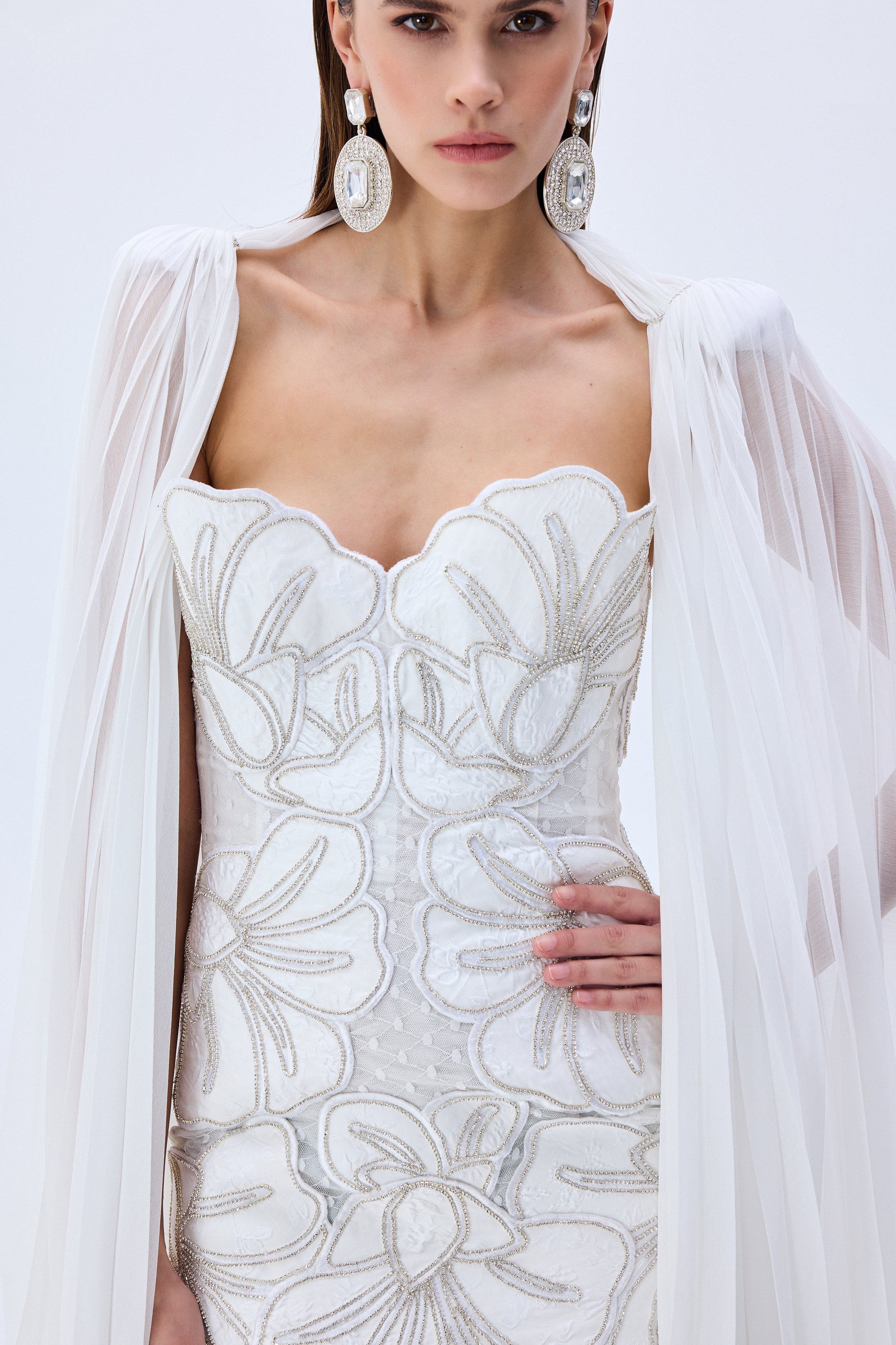 HC25-D-1005-White-40 raisa_vanessa crystal-chain-and-flower-embroidered-lace-mini-dress-with-chiffon-pleated-crystal-chain-with-cape