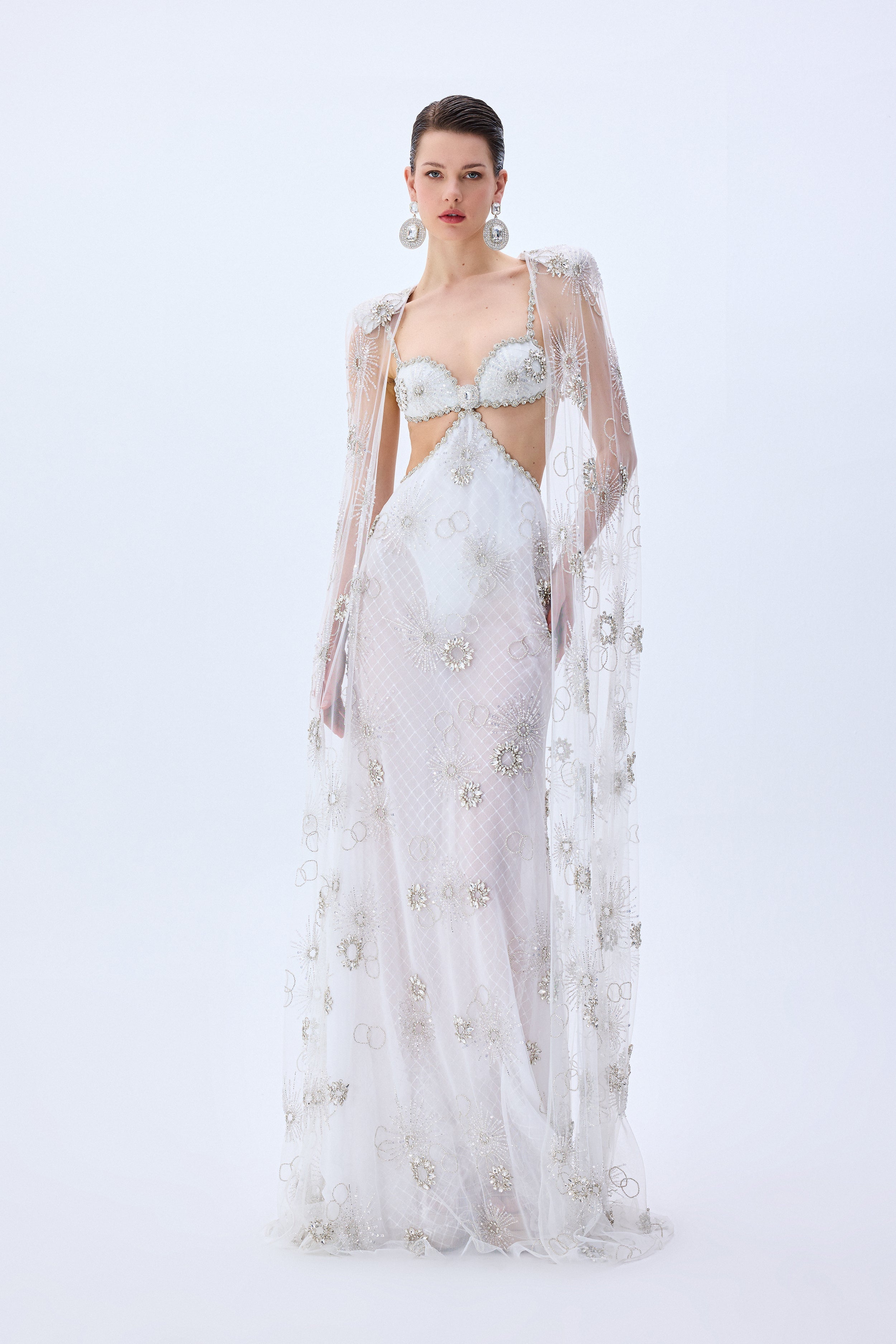 HC25-D-1008-White-34 raisa_vanessa crystal-emboridered-tulle-cut-out-gown-with-crystal-stoned-borders-and-tulle-cape-with-crystals