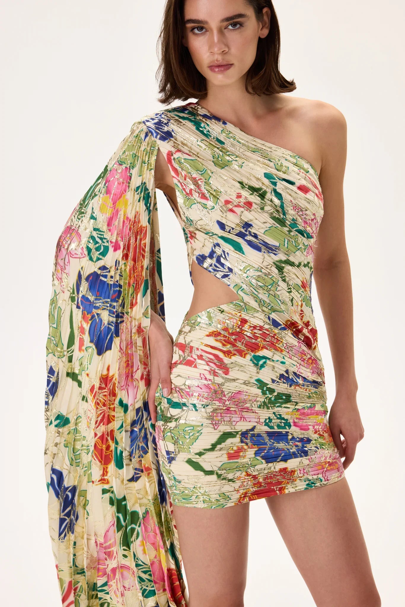 SS26-D-1027-42 raisa_vanessa ecru-pleated-viscose-multi-color-flower-printed-one-shouldered-mini-dress-with-gold-foil-accents