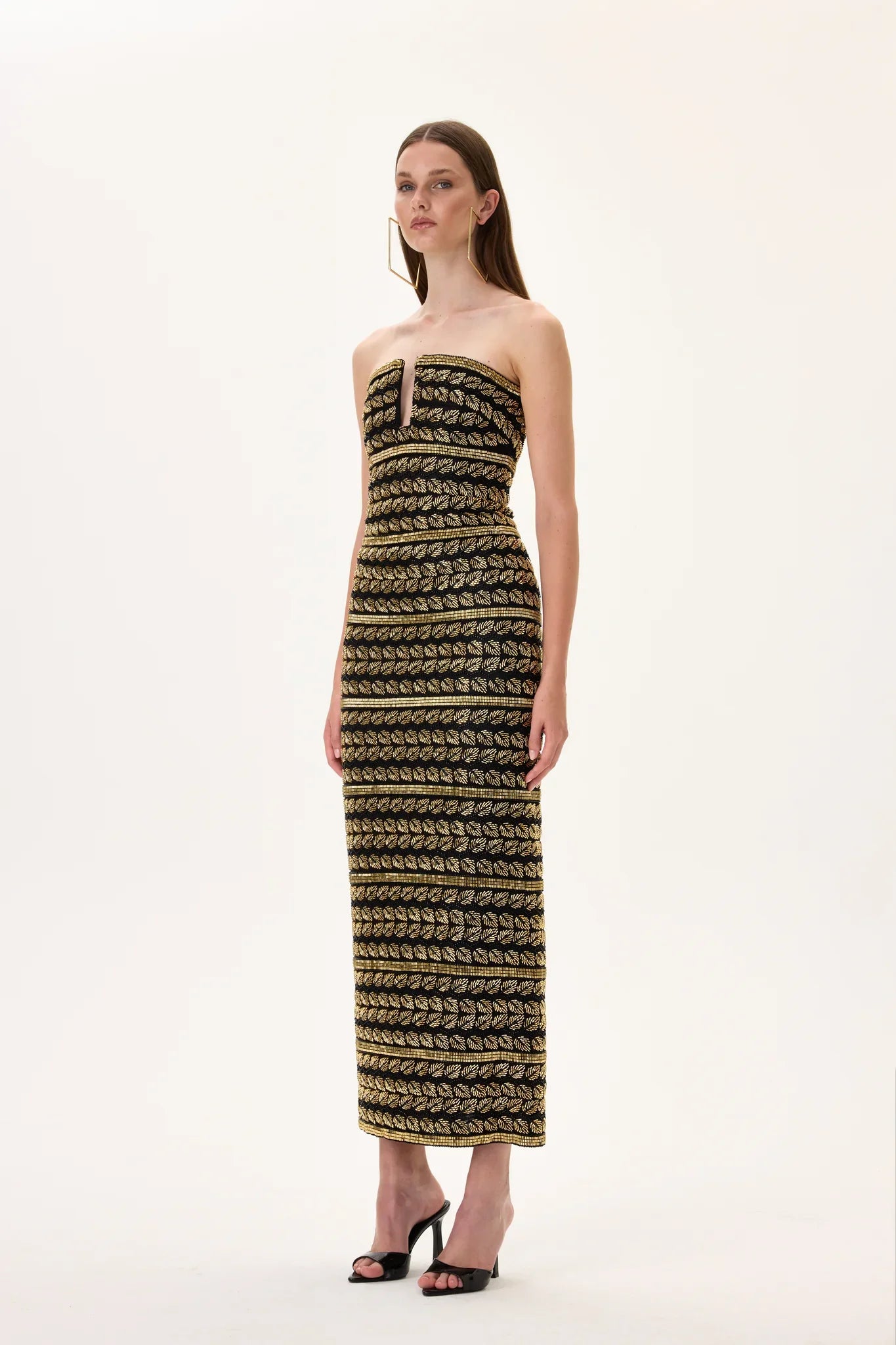 SS26-D-1050-36 raisa_vanessa black-midi-gown-with-gold-beaded-leaf-motive-strips