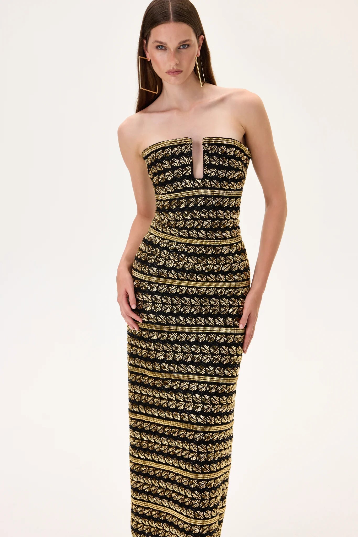 SS26-D-1050-40 raisa_vanessa black-midi-gown-with-gold-beaded-leaf-motive-strips