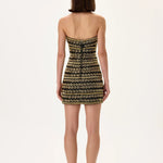 SS26-D-1051-38 raisa_vanessa black-mini-dress-with-gold-beaded-leaf-motive-strips