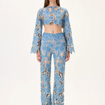 SS26-T-1002-34 raisa_vanessa denim-lace-crop-top-with-gold-metal-centered-flower-embroidery-sleeves