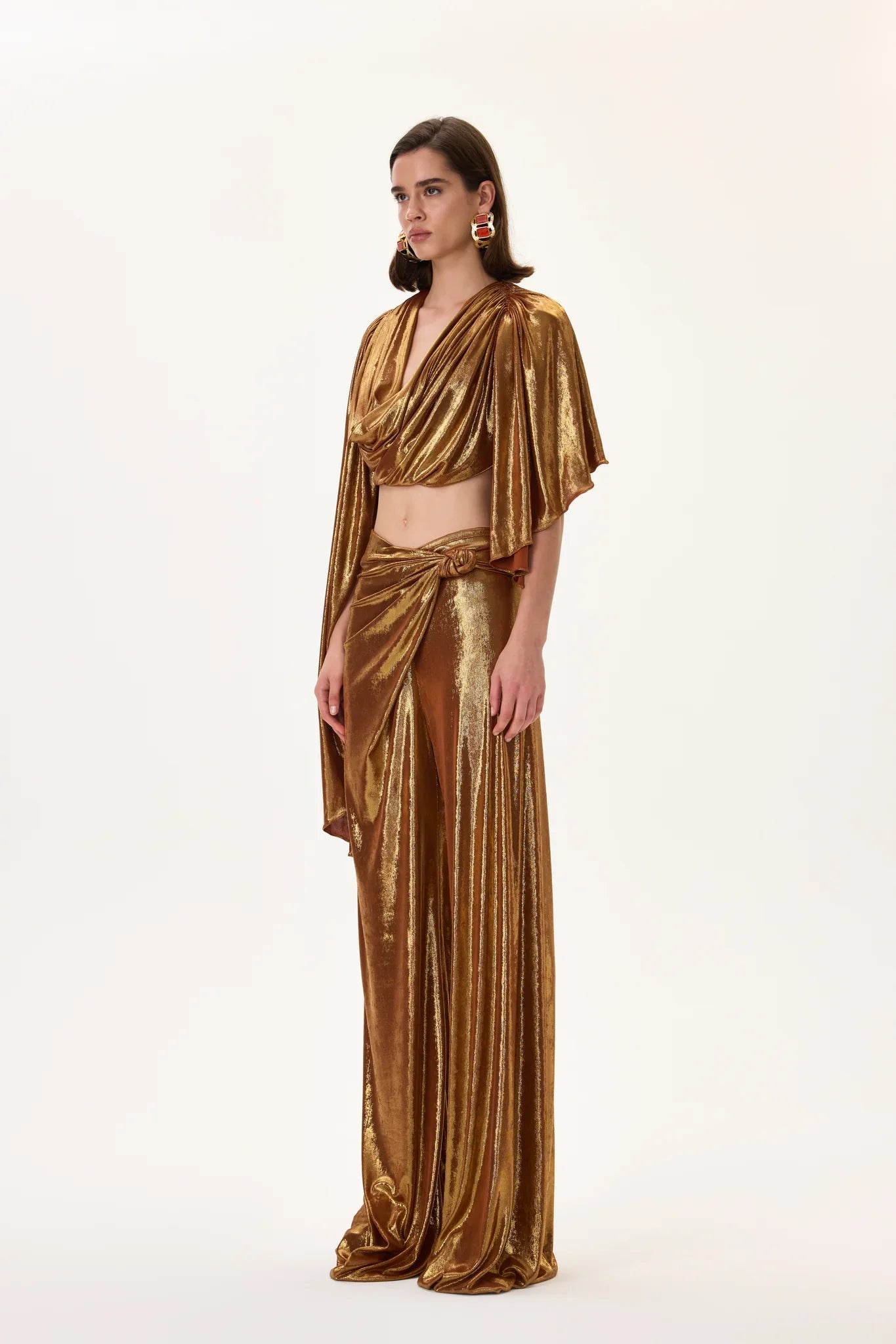 SS26-T-1009-36 raisa_vanessa bronze-metallic-jersey-cowl-neckline-backless-crop-top-with-asymmetrical-sleeves